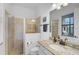 Beautiful bathroom with a glass shower, granite countertop, and modern fixtures at 13408 Swiftwater Way, Bradenton, FL 34211