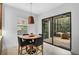 Bright breakfast nook with sliding glass doors leading to a screened patio at 13408 Swiftwater Way, Bradenton, FL 34211