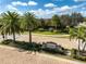 An impressive community entrance featuring lush landscaping, a decorative sign, and well-maintained surroundings at 13408 Swiftwater Way, Bradenton, FL 34211