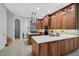 Gourmet kitchen features custom cabinetry, an island cooktop, and modern appliances at 13408 Swiftwater Way, Bradenton, FL 34211