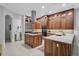 Well-appointed kitchen with stainless steel appliances, a central island, and ample cabinet space at 13408 Swiftwater Way, Bradenton, FL 34211