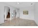 Open floor plan with tile flooring, staircase, and contemporary wall art at 13408 Swiftwater Way, Bradenton, FL 34211