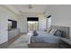 Stylish main bedroom with neutral tones, wood flooring, and balcony access at 13408 Swiftwater Way, Bradenton, FL 34211