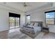 Elegant main bedroom with hardwood floors and a private balcony with a view at 13408 Swiftwater Way, Bradenton, FL 34211