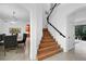 Bright foyer features a wood staircase with iron railing and access to the dining room at 13408 Swiftwater Way, Bradenton, FL 34211