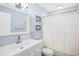 Updated bathroom features a white vanity, a new shower and modern fixtures at 13623 2Nd E Ave, Bradenton, FL 34212