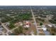 Wider aerial view showing the house and street at 15026 Dania Ave, Port Charlotte, FL 33953