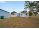 Large backyard with two storage sheds and grassy area at 15026 Dania Ave, Port Charlotte, FL 33953