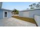 Backyard patio, storage shed, and fenced yard at 15026 Dania Ave, Port Charlotte, FL 33953