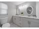 Double vanity bathroom with oval mirrors at 15026 Dania Ave, Port Charlotte, FL 33953
