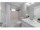 Clean bathroom with white vanity, tub, and shower at 15026 Dania Ave, Port Charlotte, FL 33953
