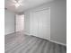 Bedroom with gray vinyl flooring and large closet at 15026 Dania Ave, Port Charlotte, FL 33953