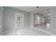 Sunlit dining area with tile floors and view of living room at 15026 Dania Ave, Port Charlotte, FL 33953