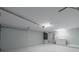 Garage with laundry area, storage, and painted floor at 15026 Dania Ave, Port Charlotte, FL 33953
