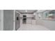 Modern kitchen with white cabinets and stainless steel appliances at 15026 Dania Ave, Port Charlotte, FL 33953