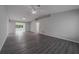 Spacious living room with gray vinyl flooring and high ceilings at 15026 Dania Ave, Port Charlotte, FL 33953
