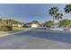 Two houses and palm trees in a residential area at 1610 Cypress Point Ct, Venice, FL 34293