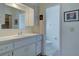 Bathroom with vanity, toilet, and updated fixtures at 1610 Cypress Point Ct, Venice, FL 34293