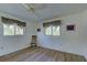 Light and airy bedroom with wood flooring and window at 1610 Cypress Point Ct, Venice, FL 34293