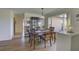 Dining area with hardwood floors and built-in hutch at 1610 Cypress Point Ct, Venice, FL 34293