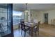 Bright dining room with hardwood floors and a large window at 1610 Cypress Point Ct, Venice, FL 34293