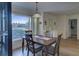 Bright dining room with large window and wood table at 1610 Cypress Point Ct, Venice, FL 34293