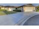 Single-story home with attached garage and landscaped yard at 1610 Cypress Point Ct, Venice, FL 34293