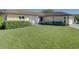 Single-story house with well-maintained lawn and landscaping at 1610 Cypress Point Ct, Venice, FL 34293