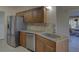 Kitchen with stainless steel appliances and granite countertops at 1610 Cypress Point Ct, Venice, FL 34293