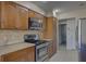 Kitchen with stainless steel appliances and granite countertops at 1610 Cypress Point Ct, Venice, FL 34293