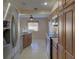 Kitchen with stainless steel appliances and granite countertops at 1610 Cypress Point Ct, Venice, FL 34293