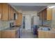 Kitchen with stainless steel appliances and granite countertops at 1610 Cypress Point Ct, Venice, FL 34293
