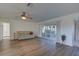 Spacious living room with hardwood floors and access to a screened porch at 1610 Cypress Point Ct, Venice, FL 34293