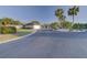 Residential neighborhood with palm trees and curved street at 1610 Cypress Point Ct, Venice, FL 34293
