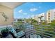 Relaxing balcony with pool view and comfortable seating at 1703 N Tamiami Trl # 209, Sarasota, FL 34234