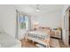 Bright bedroom with a queen-size bed and large window, offering natural light at 1703 N Tamiami Trl # 209, Sarasota, FL 34234