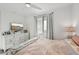 Spacious bedroom with large window and dresser at 1703 N Tamiami Trl # 209, Sarasota, FL 34234