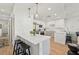 Modern kitchen with white cabinets, stainless steel appliances, and a breakfast bar at 1703 N Tamiami Trl # 209, Sarasota, FL 34234