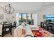 Open living space with access to a balcony and pool views at 1703 N Tamiami Trl # 209, Sarasota, FL 34234