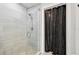 Clean and modern walk-in shower with glass enclosure at 1703 N Tamiami Trl # 209, Sarasota, FL 34234