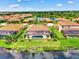 Aerial view of luxury homes with lake access at 20686 Valprato Ct, Venice, FL 34293