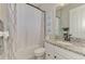 Bathroom features a shower/tub combo, granite countertop, and decorative seashell art at 20686 Valprato Ct, Venice, FL 34293