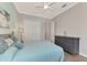 Bedroom with a large closet, ceiling fan, and comfortable furniture with calming colors at 20686 Valprato Ct, Venice, FL 34293