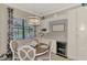 Bright breakfast nook with backyard views, built-in wine cooler, and elegant cabinetry at 20686 Valprato Ct, Venice, FL 34293