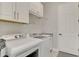Well-equipped laundry room with modern appliances and ample storage space at 20686 Valprato Ct, Venice, FL 34293