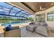 Relaxing patio furniture with lake view at 20686 Valprato Ct, Venice, FL 34293