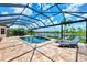 Enjoy the lake view from this screened pool area at 20686 Valprato Ct, Venice, FL 34293