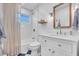 Bright bathroom with white vanity, bathtub, and shower at 2226 Arlington St, Sarasota, FL 34239