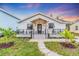Charming craftsman style home with a welcoming front porch and landscaped yard at 2226 Arlington St, Sarasota, FL 34239
