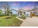 Two story home with a gravel driveway and nicely landscaped yard at 2226 Arlington St, Sarasota, FL 34239